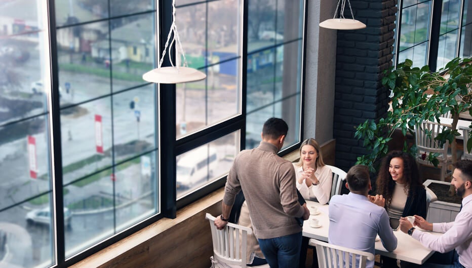 group of people at table  with view