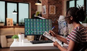 Woman on laptop with coffee