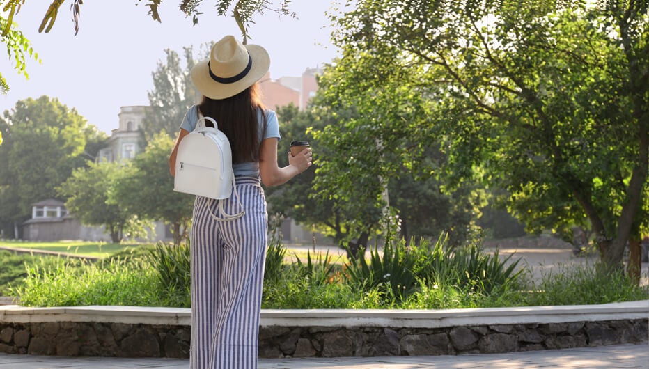 Woman in park with coffee