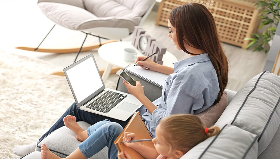 Woman and baby girl on couch