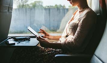 woman at home looking at laptop